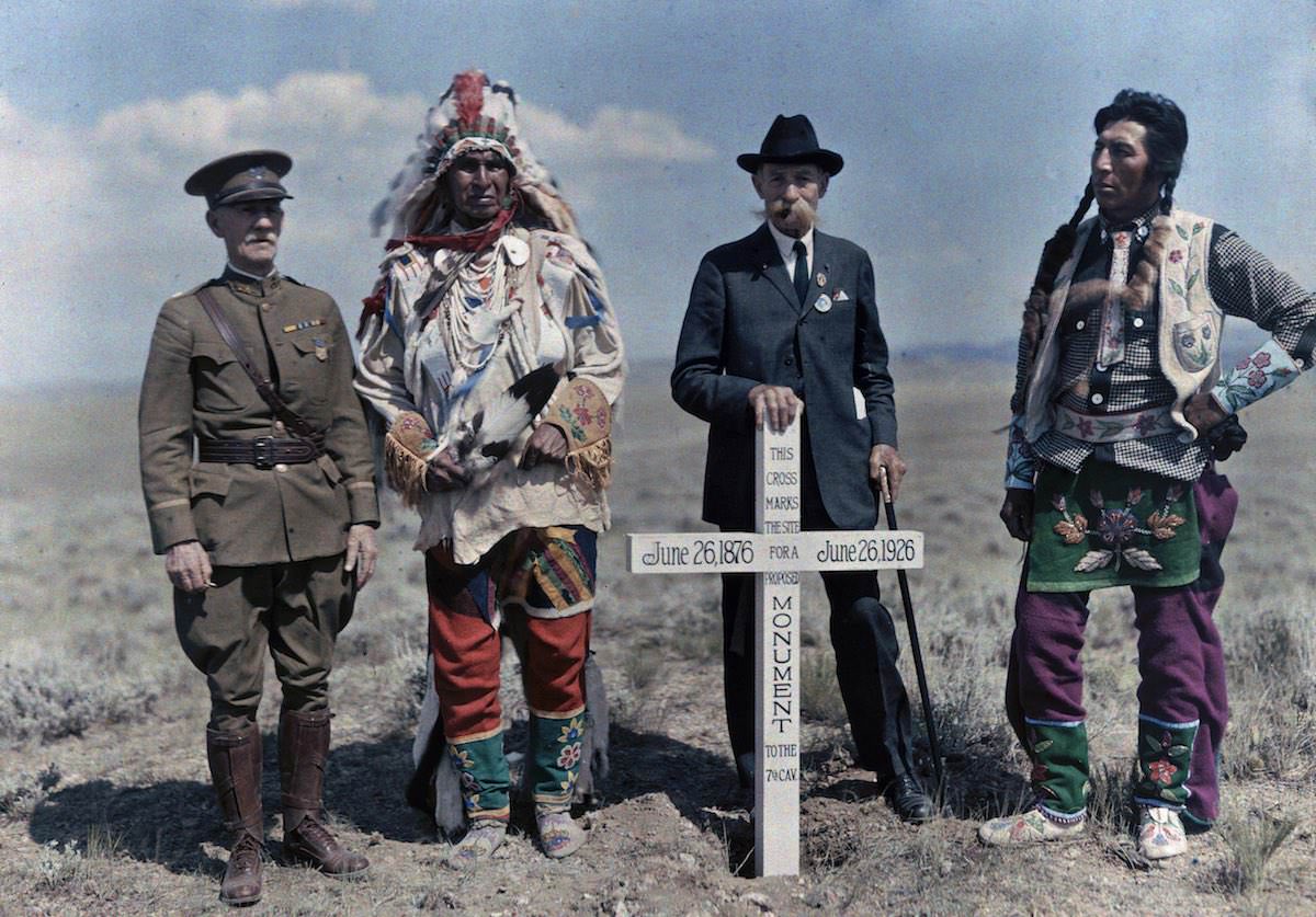 #48 Men stand next to the monument to the Seventh Cavalry. Crow Indian Reservation, Montana