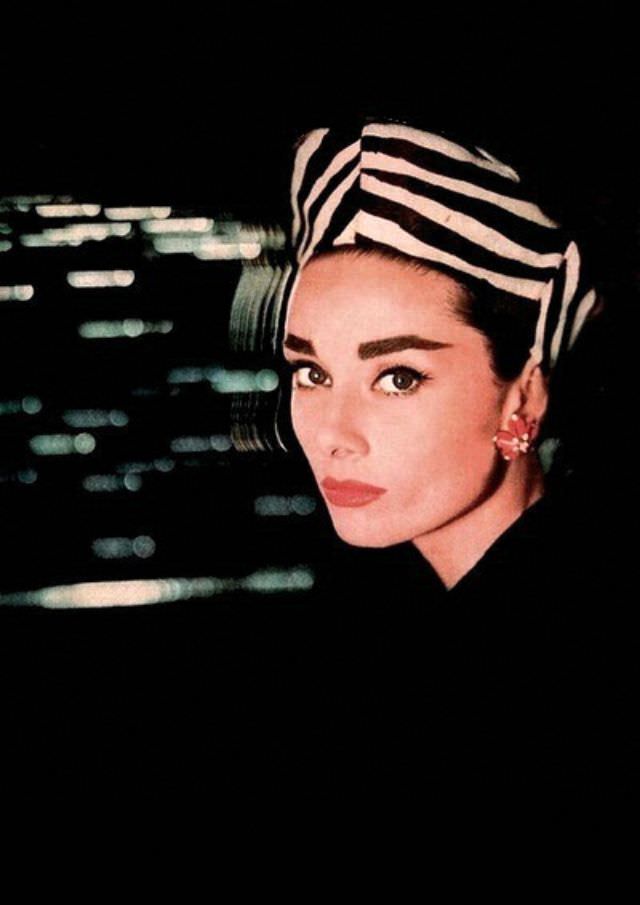 #28 Audrey Hepburn, hat by Lilly Daché, earrings by Bulgari, Harper’s Bazaar, October 1956