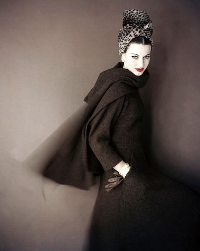#38 Model is wearing a brown tweed walking dress with an interesting wrap of stole in the same tweed by Pauline Trigère and the tall turban is from, Vogue, September 1959