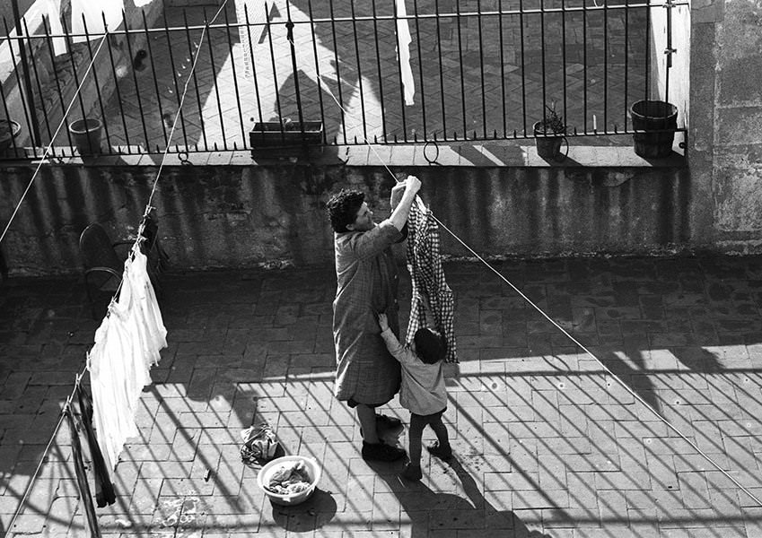 #35 A woman hanging laundry, 1964.