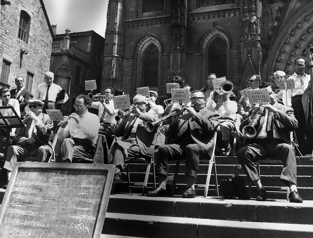 #60 The Cobla Popular band playing on the steps of the cathedral in Barcelona, October 1966.