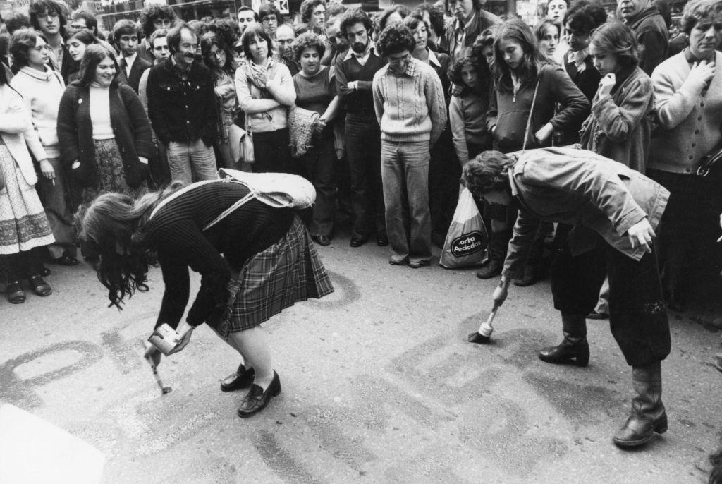 #67 Activists of the PTE (Workers’ Party of Spain) painting sogans on the ground during the campaign of the Spanish general elections of 1977 in Barcelona.
