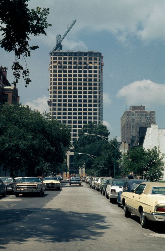 #24 Newberry Plaza condominium tower during construction, looking west along Bellevue Place, 1972