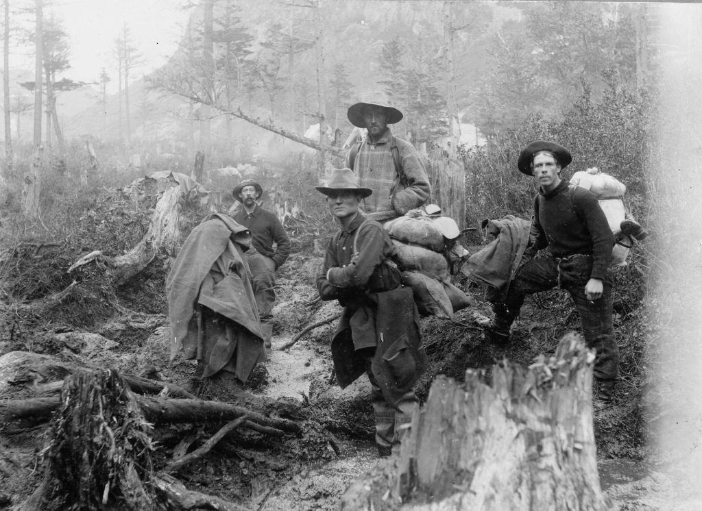 #28 Ffour prospectors posed on a trail, Alaska, 1897.