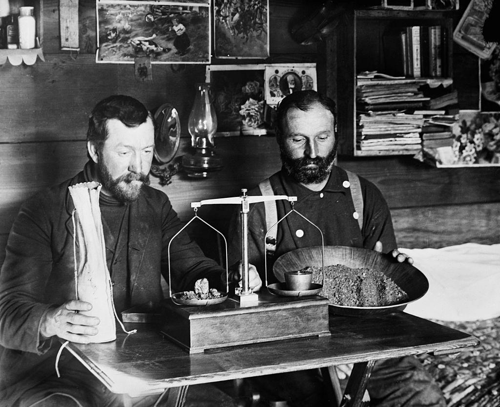 #36 Alaska- Gold mining weighing winter clear-up of gold, 1897.