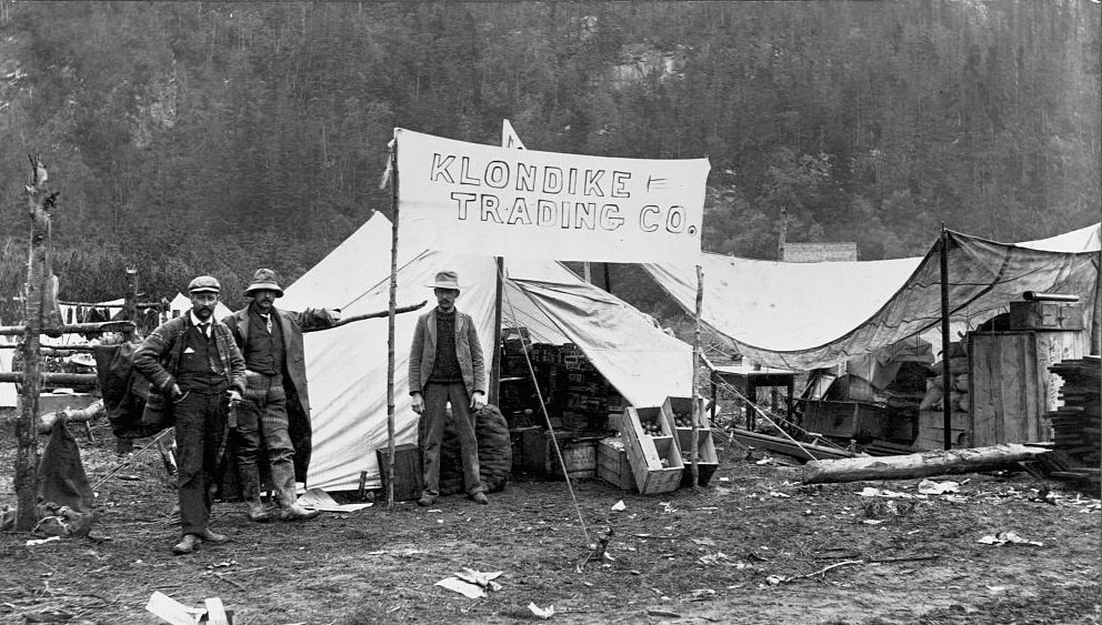 #39 The Klondike Trading Company, a general store in a tent, during the Klondike Gold Rush. Alaska, 1897.
