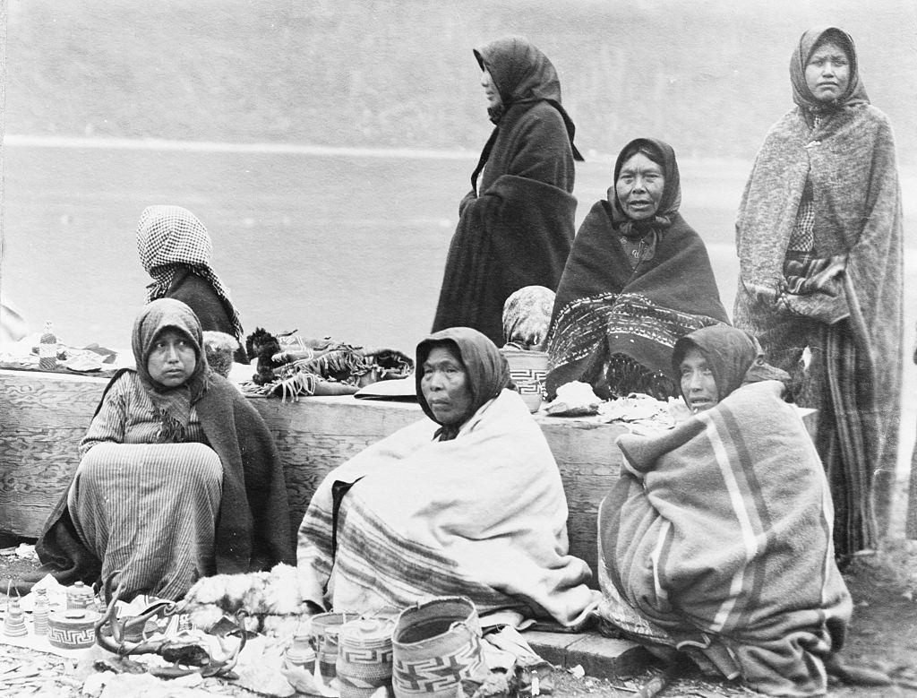 #15 Tlingit women selling baskets and other small items, at the Treadwell Mine site, for tourists arriving in Alaska by steamship, January 1890.
