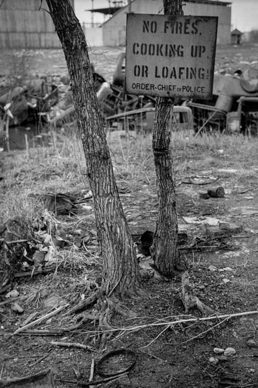 #8 A sign in the river bottoms shacktown in Dubuque. 1940.
