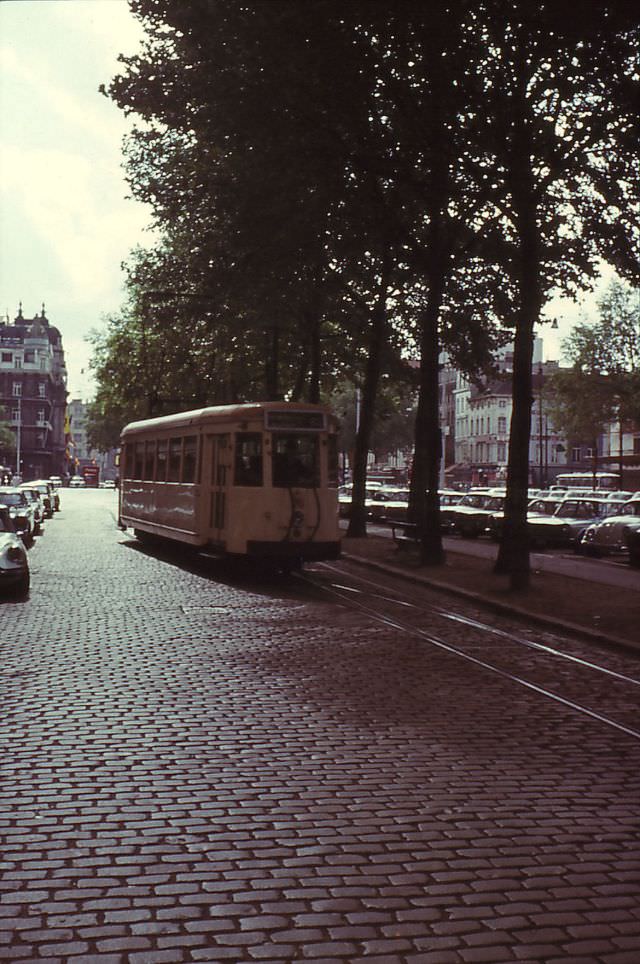 #7 Motorcar 9659 on route Nº 63 (NMVB) has just left the terminus on the Franklin Rooseveltplaats / square and running on the Italiëlei, Antwerp.