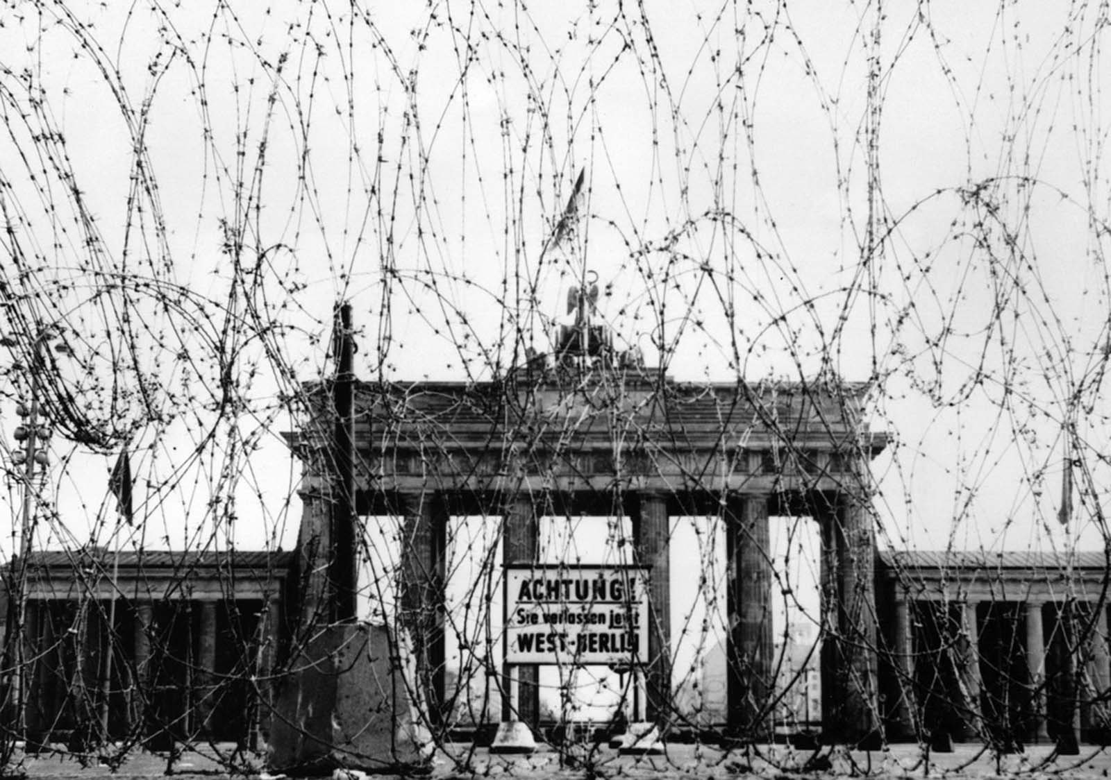 #53 Barbed wire on the west side of the Brandenburg gate, put up as a “safety measure” by the British, photographed in November 1961.