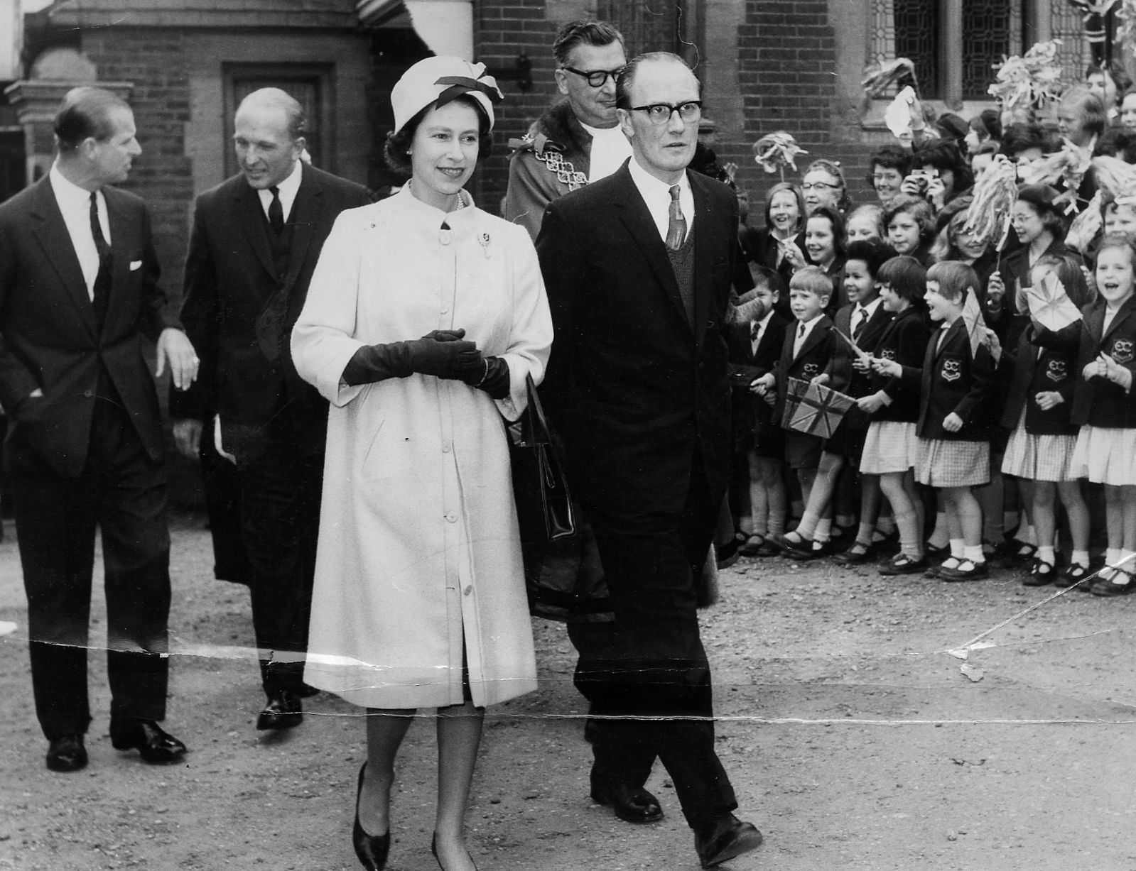 #37 HRH The Queen along with Coun S Turner, Chairman of the Children’s Committee, leaving 32 Calthorpe Road in 1963.