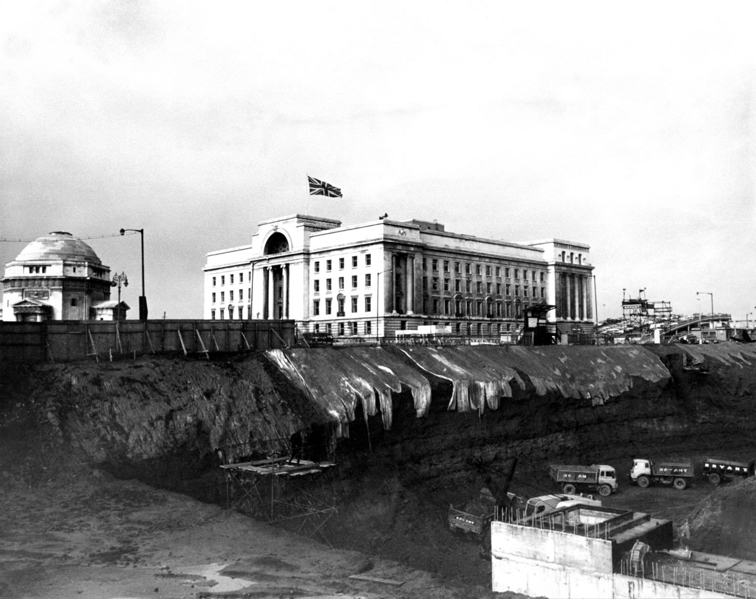 #41 Baskerville House appears precariously perched above the huge hole that will rise Paradise Circus, 10th Sept 1969.