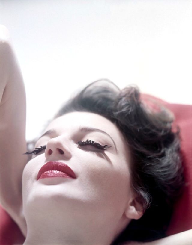 #5 Maria Reachi wearing cut-out paper lashes, Good Housekeeping, 1952