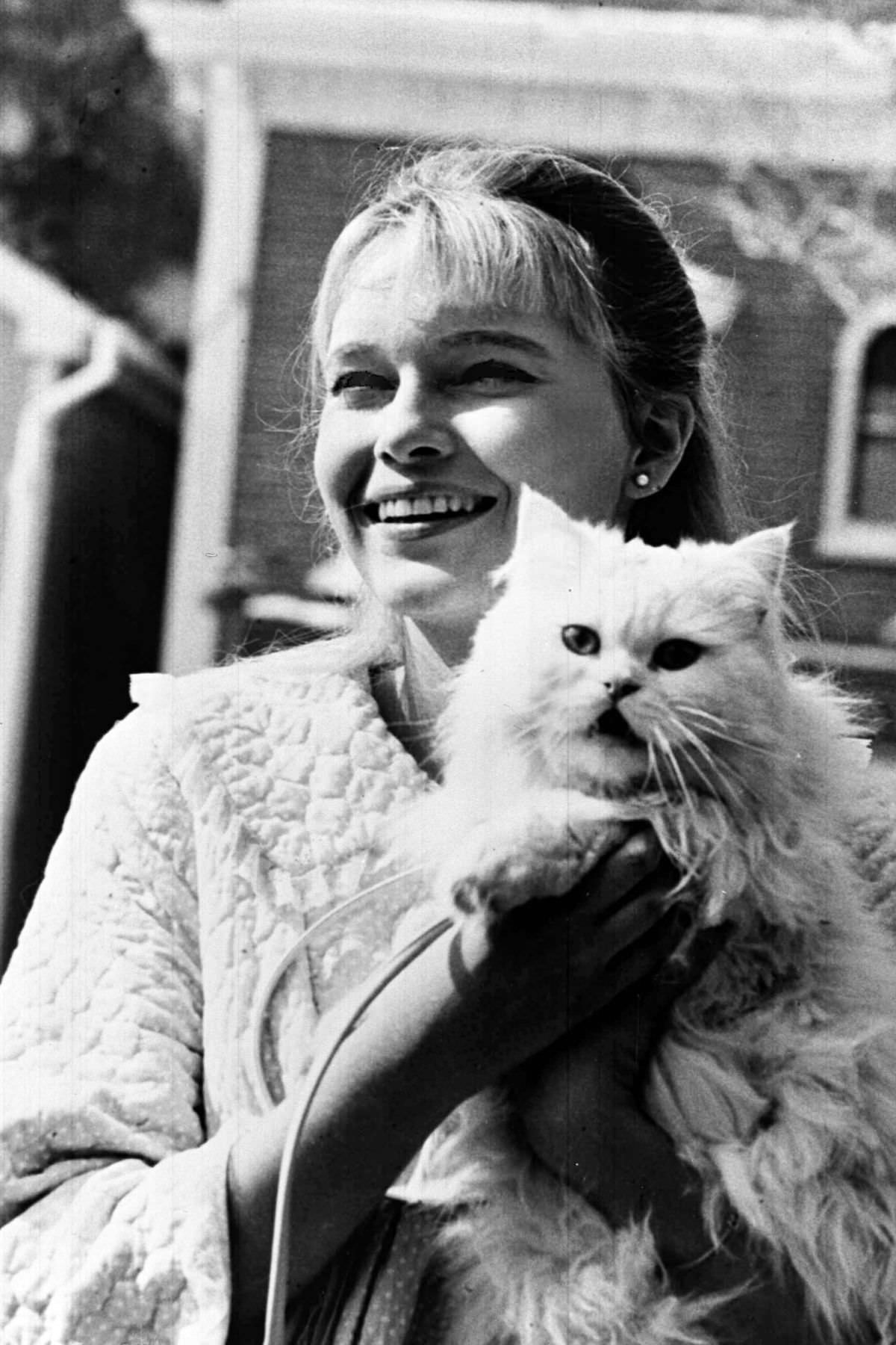 #24 Mia Farrow was photographed with her cat companion Ref. September 12, 1965