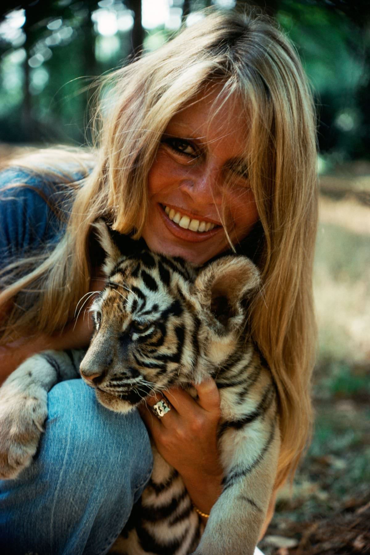 #32 The French actress-singer Brigitte Bardot turned animal-rights activist cuddled with a tiger on a trip to Abidjan, Côte d’Ivoire, in 1976.
