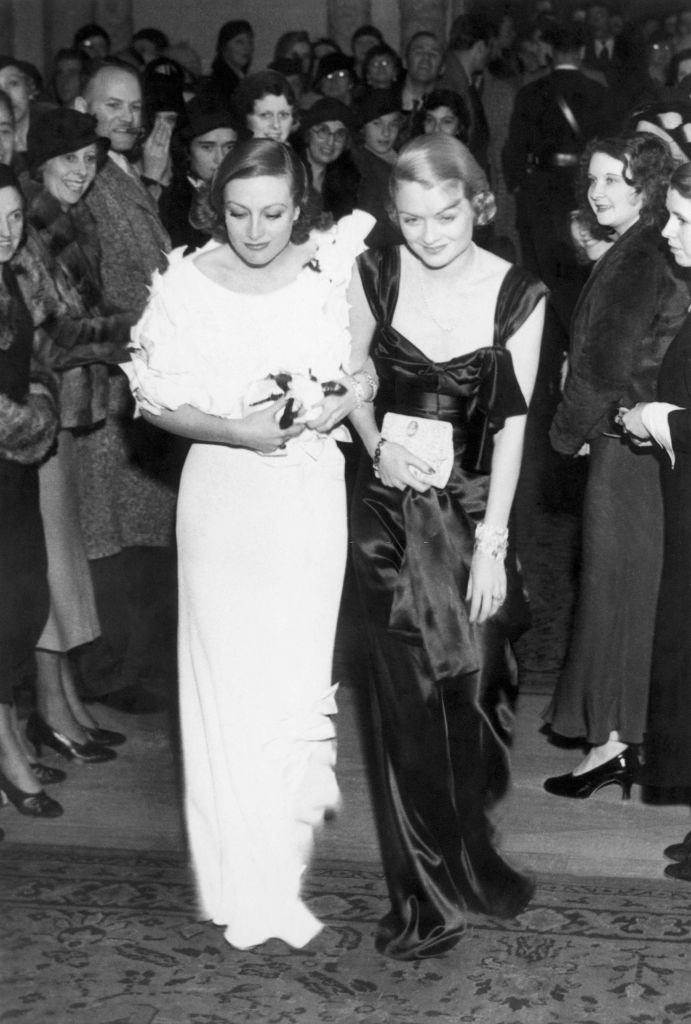 #31 Constance Bennett with Joan Crawford arriving at the Mayfair Club Party at the Biltmore Hotel in Los Angeles, 1932.