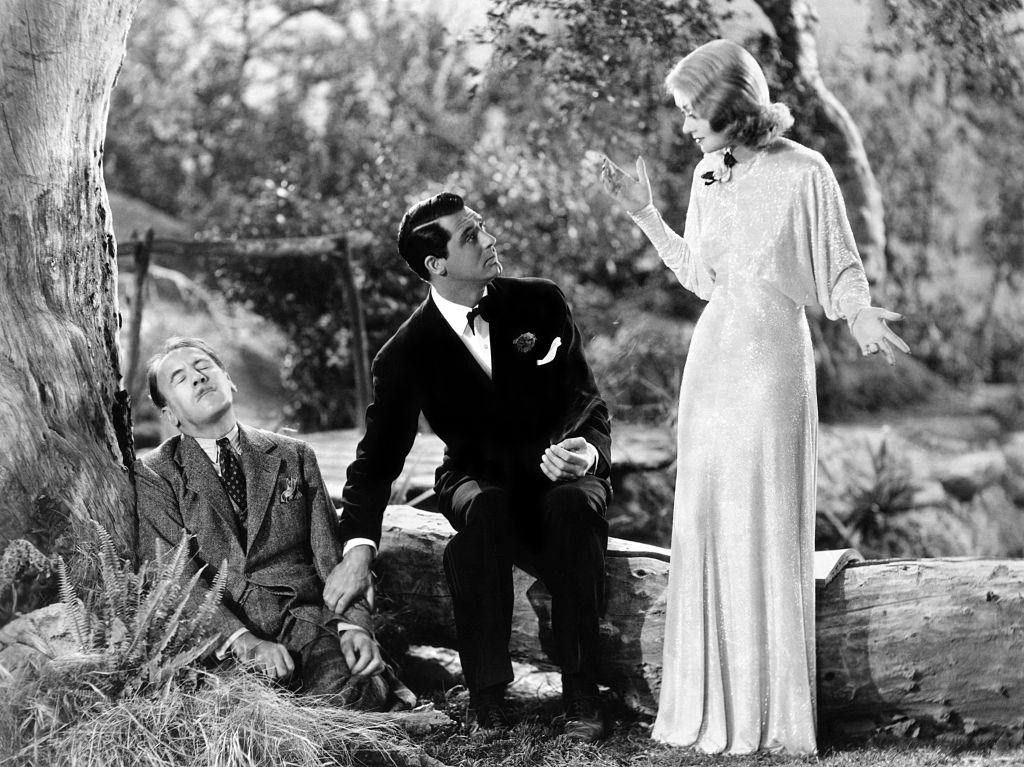 #18 Constance Bennett wiht Roland Young and Cary Grant in a scene from the movie Topper.