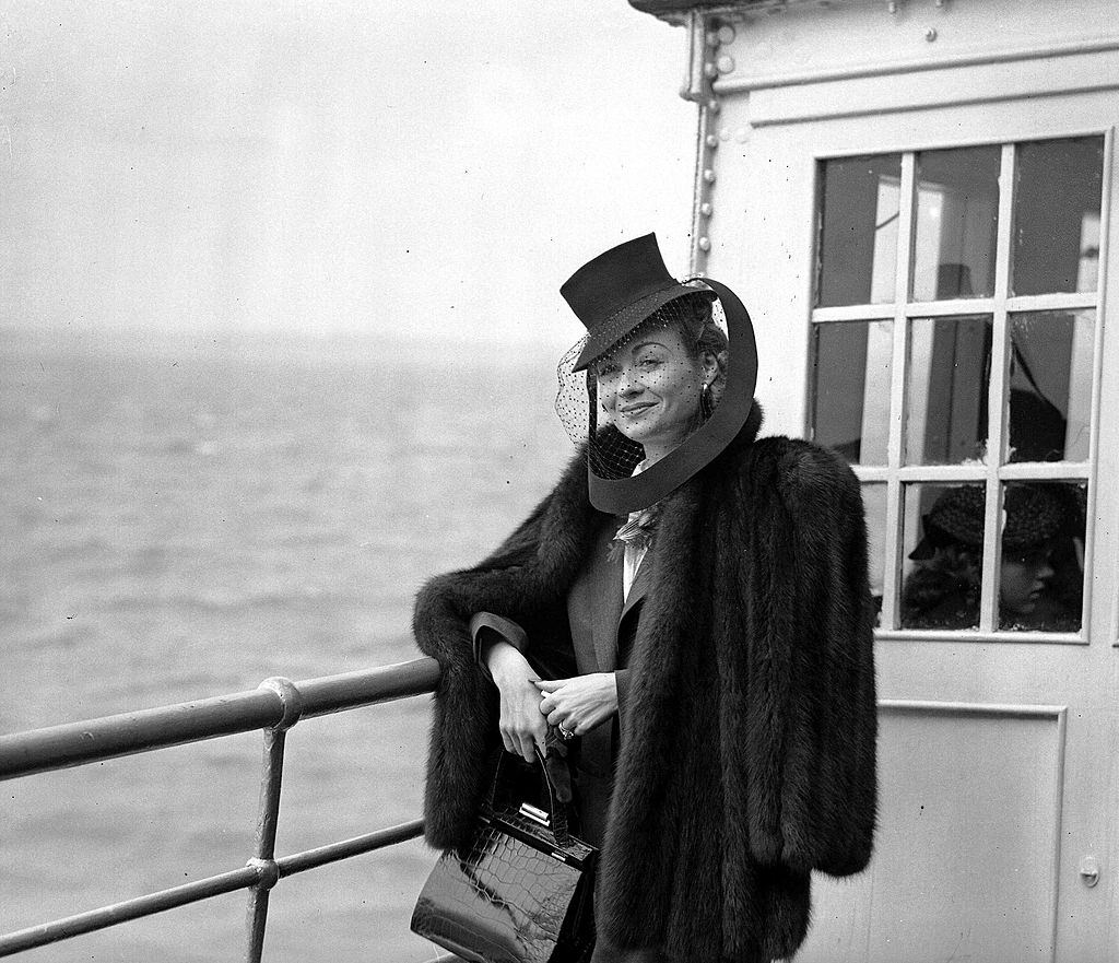 #52 Constance Bennett upon arrival at Southampton aboard the liner ,Normandie from New York, 1939.
