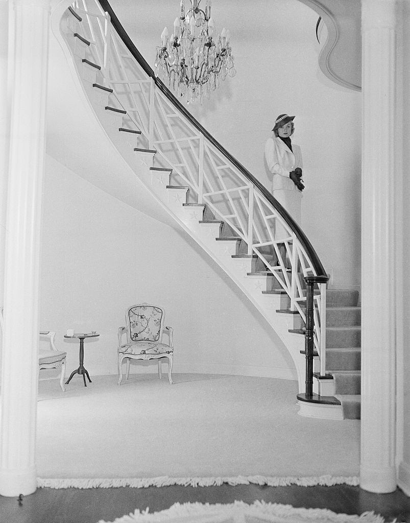 #1 Constance Bennett pose inside her home in Los Angeles, 1940.