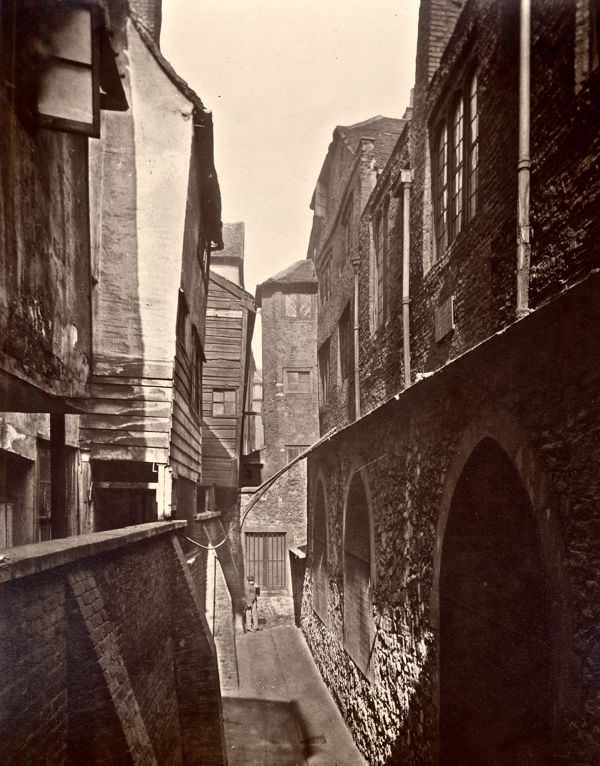 #11 At the back of St Bartholomew’s, Smithfield, 1877.