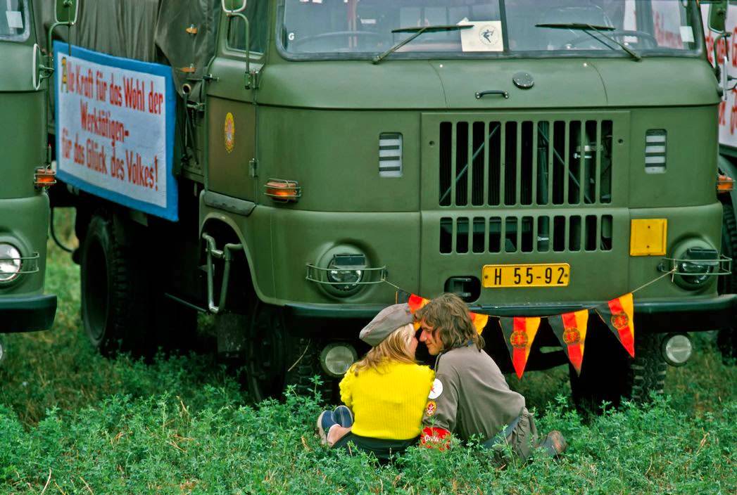 #1 Uniformed couple flirting during a military air show in Magdeburg. Magdeburg, 1974.