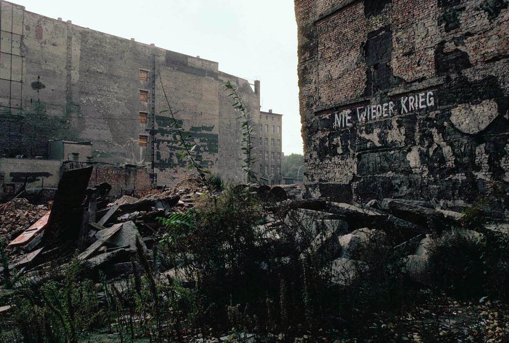 #37 Ruins left from World War II, with the insciption: “Never again War”. East Berlin, 1974