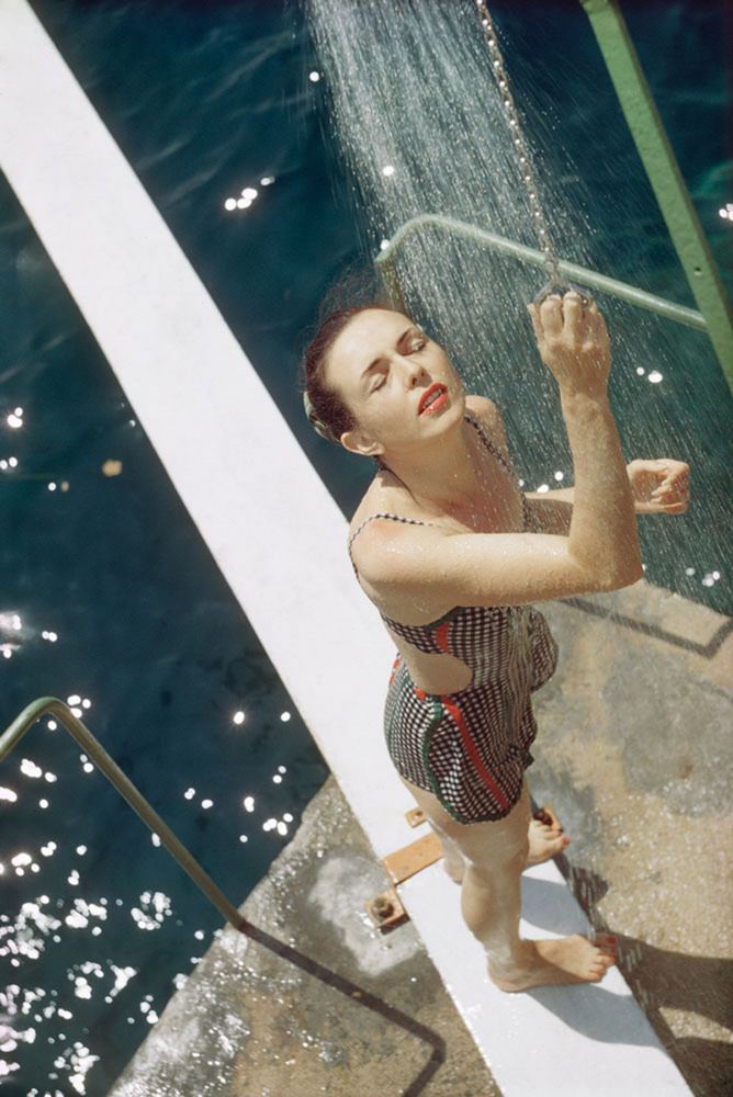 #16 A girl from opio taking a shower, 1960s.