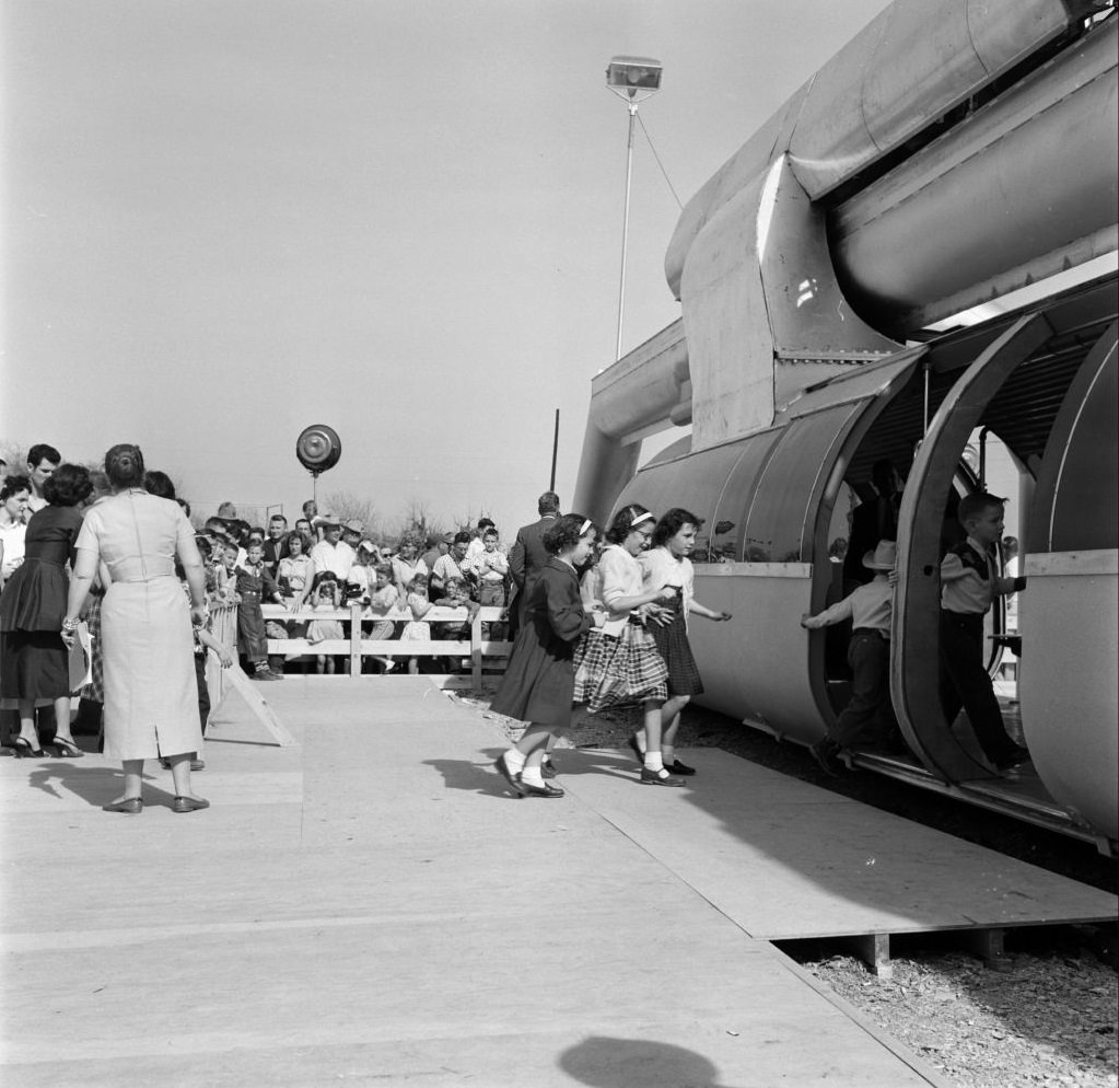 #51 Children boarding a monorail train, Houston, Texas, February 1956