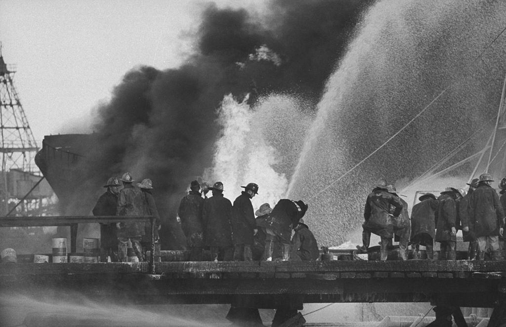 #45 Fire fighters at tankers explosion in ship channel, 1959.