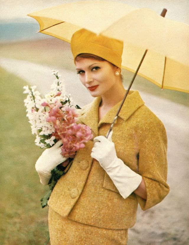 #33 Isabella Albonico in lemon gold wool tweed suit by George Carmel, hat by Emme, Marvella earrings. Harper’s Bazaar, February 1960