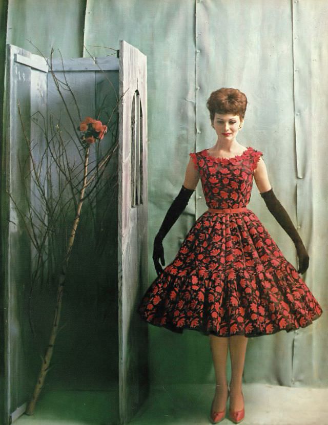 #35 Isabella Albonico in ravishing late day dress of black Swiss organdie covered with red flowers by Traina-Norell. Harper’s Bazaar, April 1960