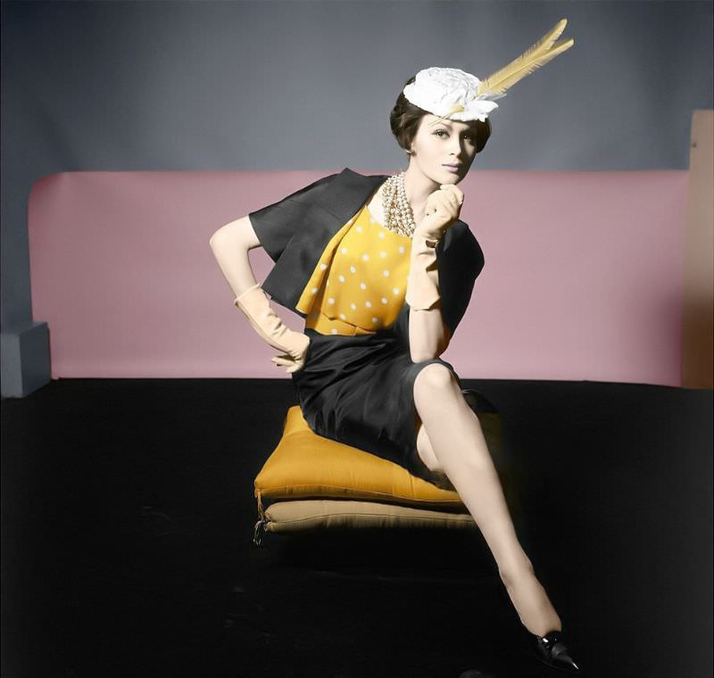 #45 Isabella Albonico is wearing a black silk shantung suit with yellow and white polka-dot blouse which also lines the jacket. Vogue, March 15, 1961