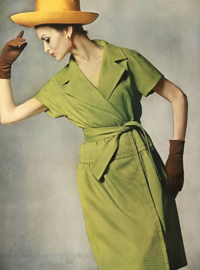 #46 Isabella Albonico in green cotton-dacron summer coat-dress by Maurice Rentner, orange silk-shantung Breton by Mr. John. Vogue 1962