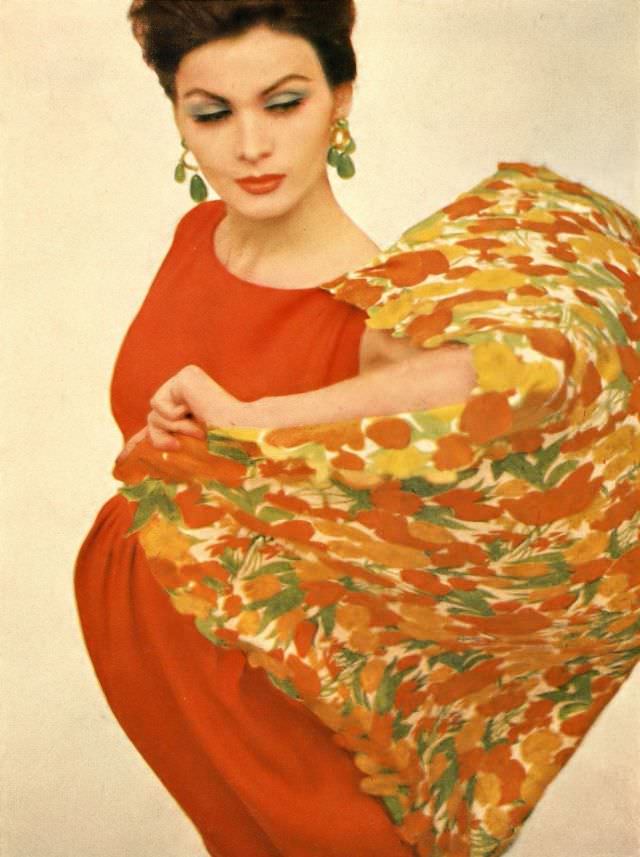 #47 Isabella Albonico in orange Moygashel linen dress worn with orange and limes appliquéd silk half-moon shawl. Harper’s Bazaar, April 1962