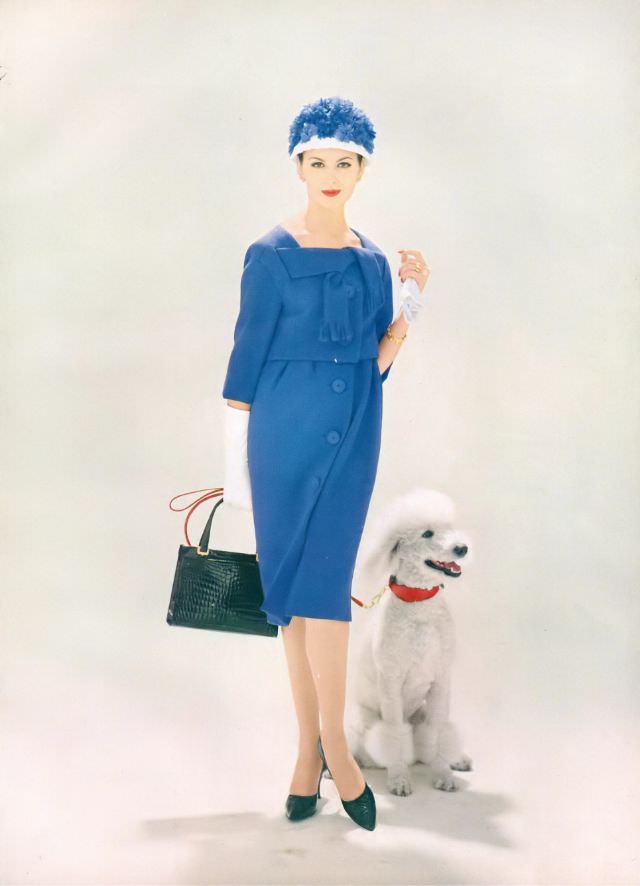 #1 Isabella Albonico in bright hyacinth wool town suit, a cropped top ties across the shoulders, and an eased skirt on a camisole. Vogue, February 1, 1959