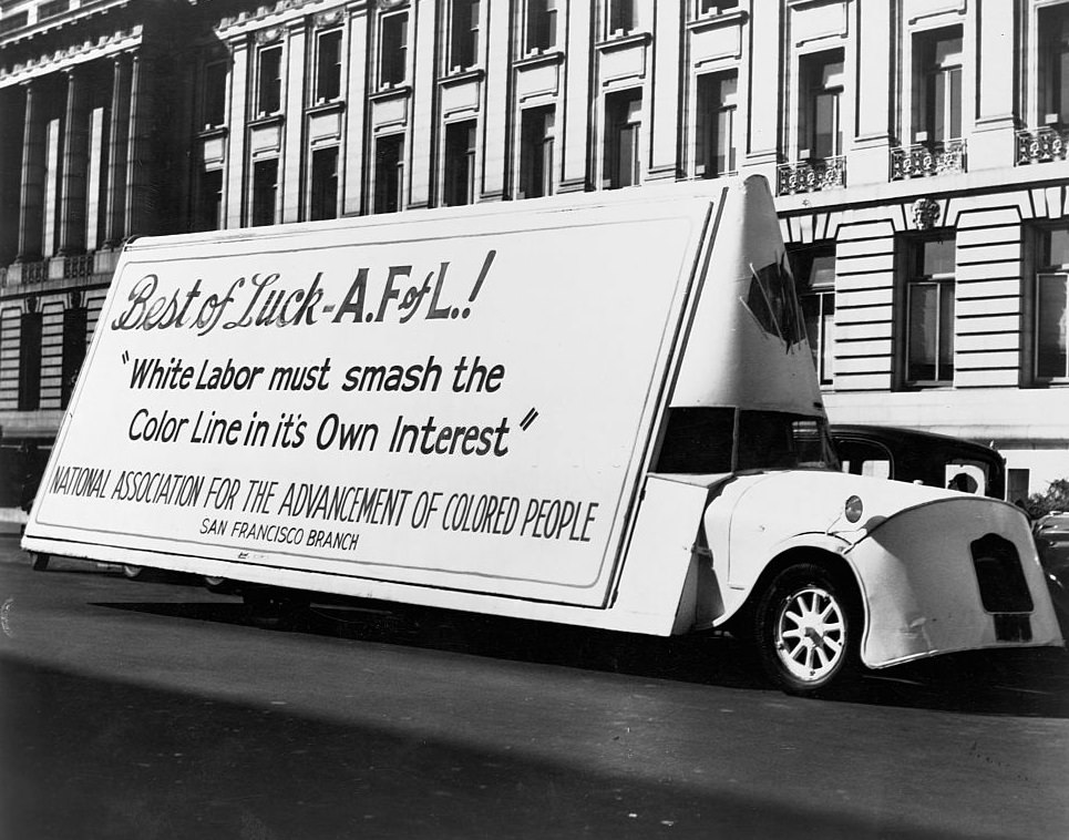 #17 A moving billboard in a parade in Detroit, sponsored by the NAACP, congratulates the American Federation of Labor’s stand against race discrimination, 1944.