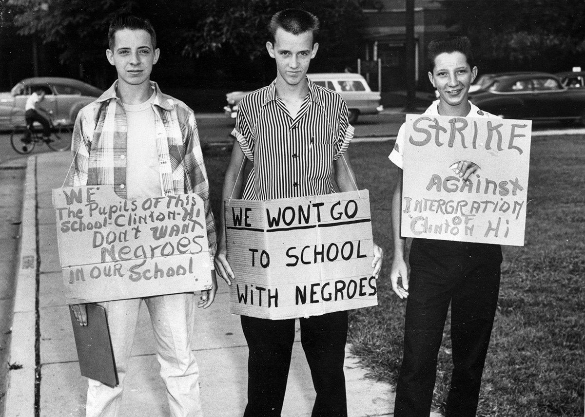 #28 From left: Buddy Trammell, Max Stiles, and Tommy Sanders, students at Clinton High School in Clinton, Tennessee, picket their school when it becomes the first state-supported school to integrate, on Aug. 27, 1956.