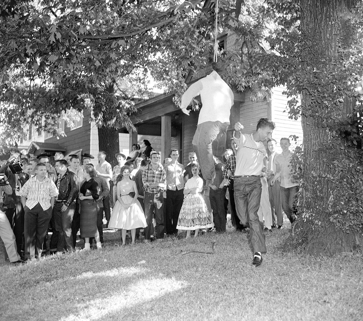 #72 A white student slugs an effigy of a hanging black student outside Central High School in Little Rock, Arkansas, on Oct. 3, 1957, as nearly 75 students of the school walked out to protest integration.