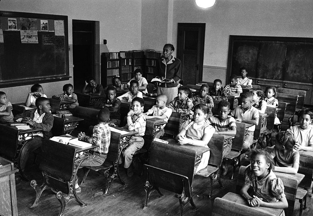 #41 African-American student Linda Brown (first desk in second row from right) sits with her classmates at the racially segregated Monroe Elementary School, Topeka, Kansas, 1953.