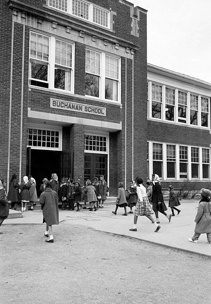 #43 African American children arriving for class at the segregated Buchanan Elementary School, 1953.