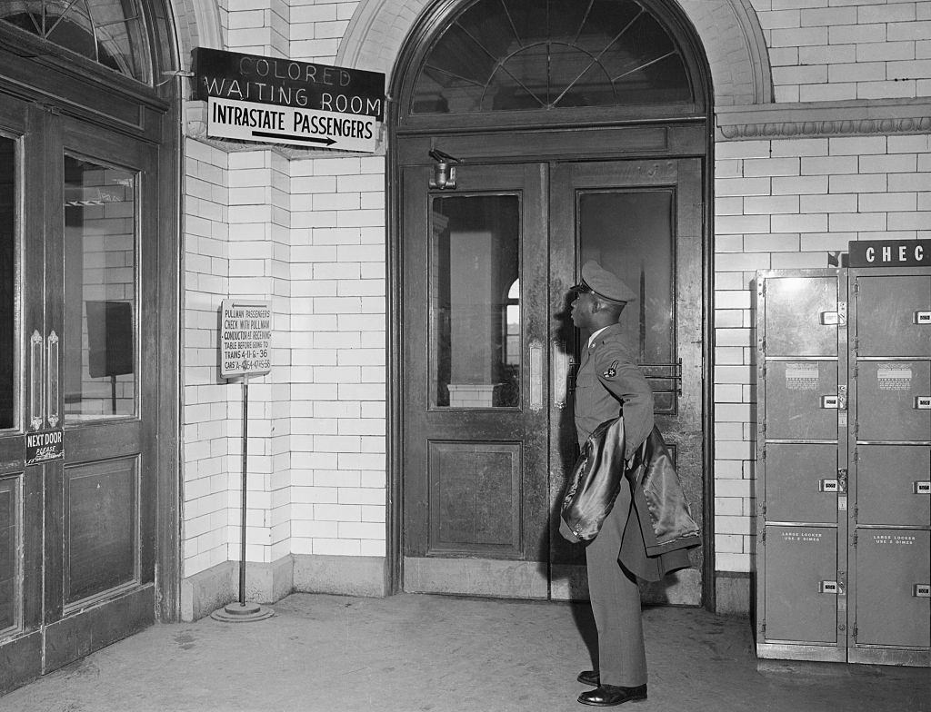 #49 African American Soldier Reads Segregated Terminal Sign, 1956.