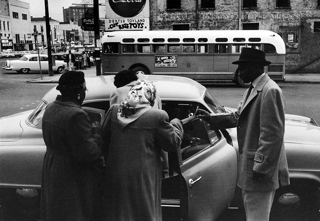#51 A group of African Americans get into an automoboile to car pool during the Montgomery bus boycott, Montgomery, Alabama, February 1956.