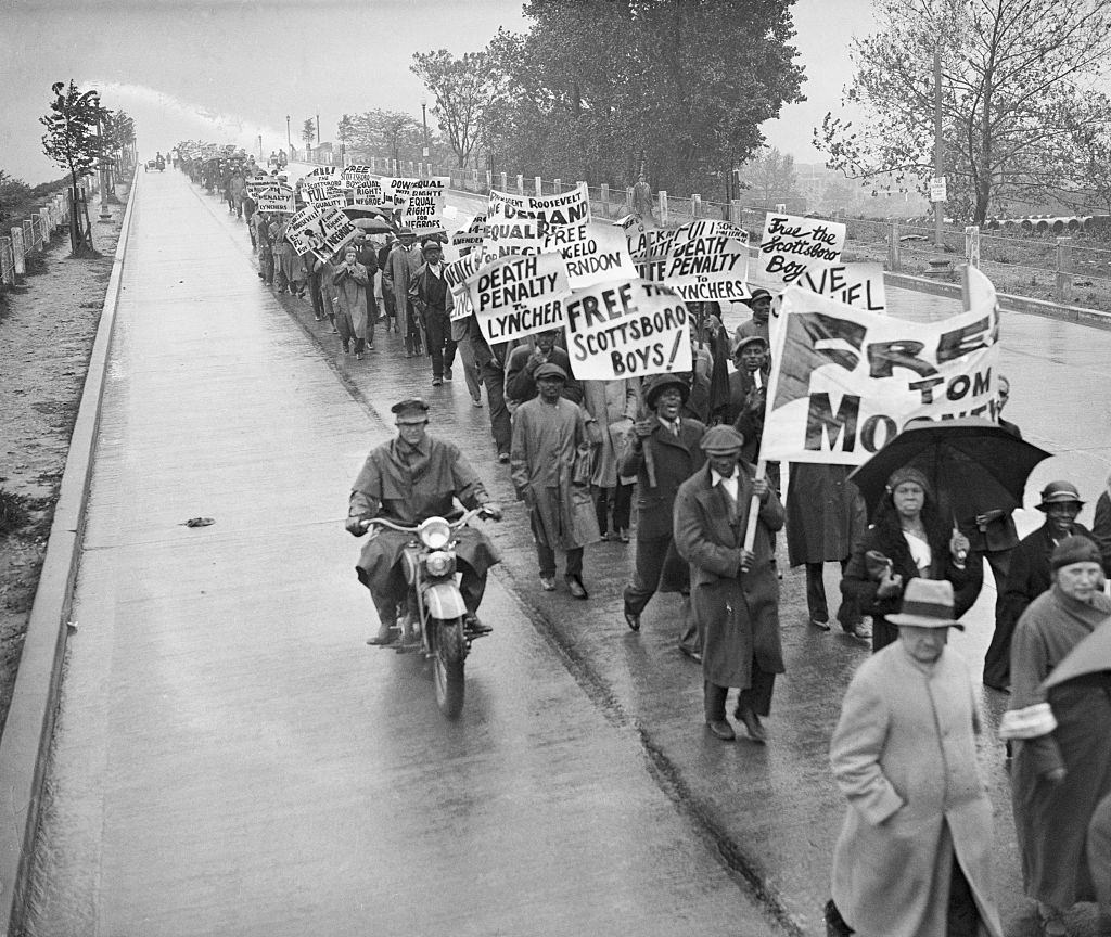 #58 Hundreds of demonstrators march in Washington D.C. against the trials in the Scottsboro case.