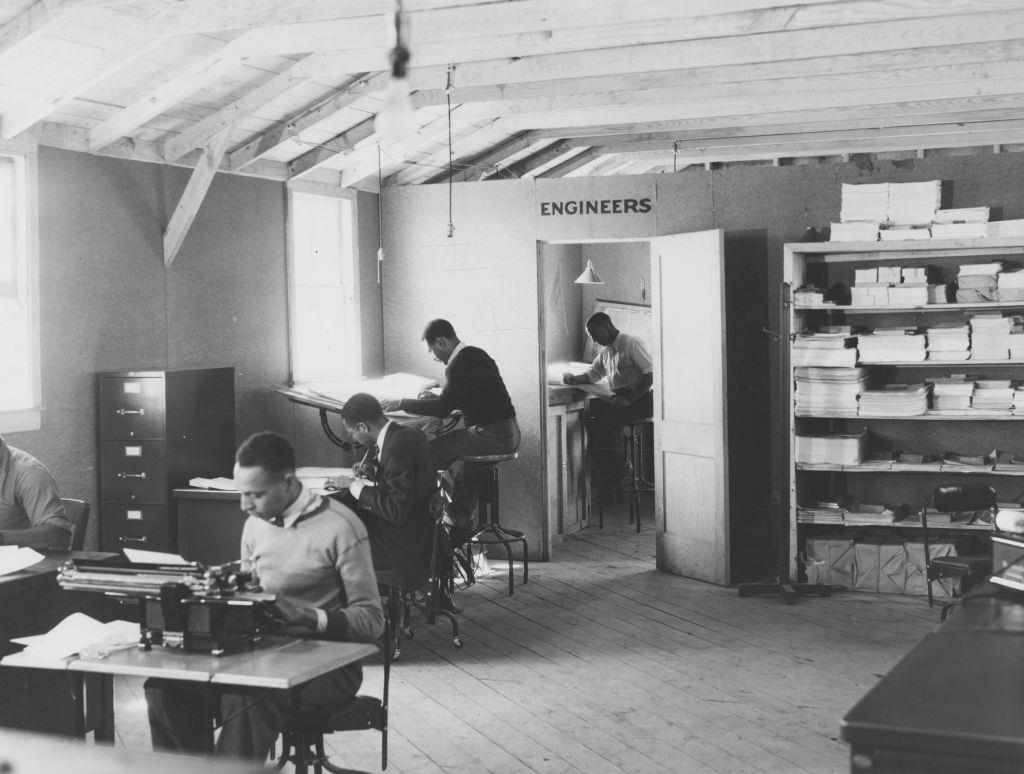 #67 Black and white photograph of male, African-American engineers, working in an apparently segregated office, located in Newport News, Virginia, 1936.