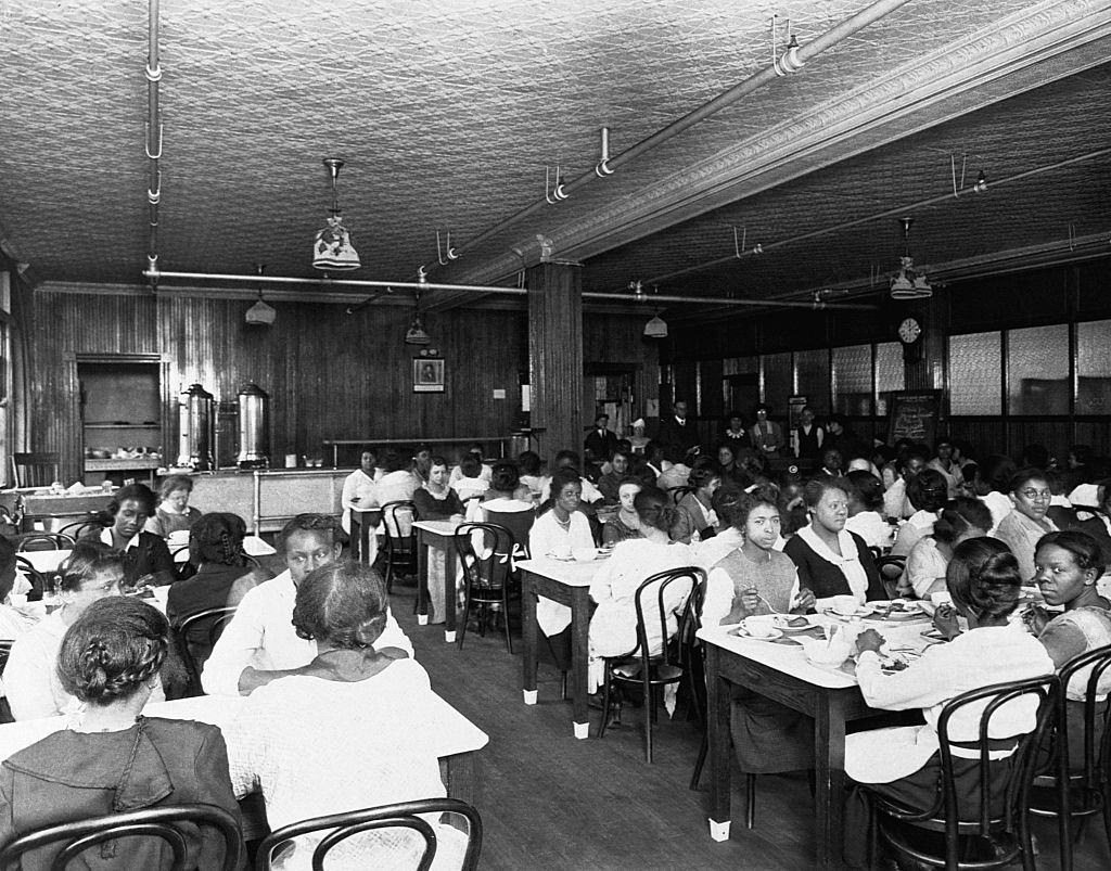 #68 African American workers eat in a segregated lunchroom at an American factory. Ca. 1930s.