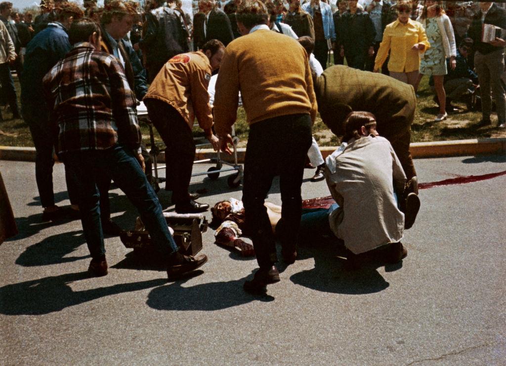 #15 People carrying a dead body of protestor who was shot down by the National Guards, May 4th 1970.