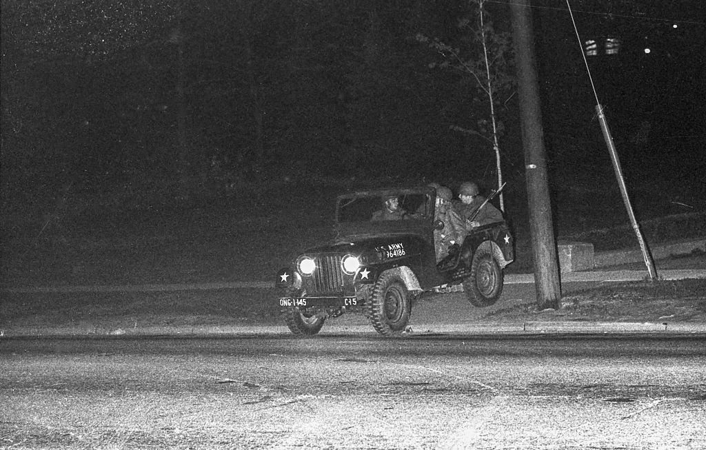 Ohio National Guardsmen in a jeep as they enforce a curfew on the Kent State University campus, Kent, Ohio, May 3, 1970.