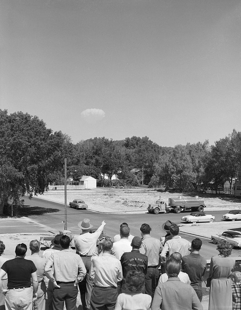 #23 Residents of Las Vegas watch the mushroom cloud of a distant test of an atomic bomb, 1952.