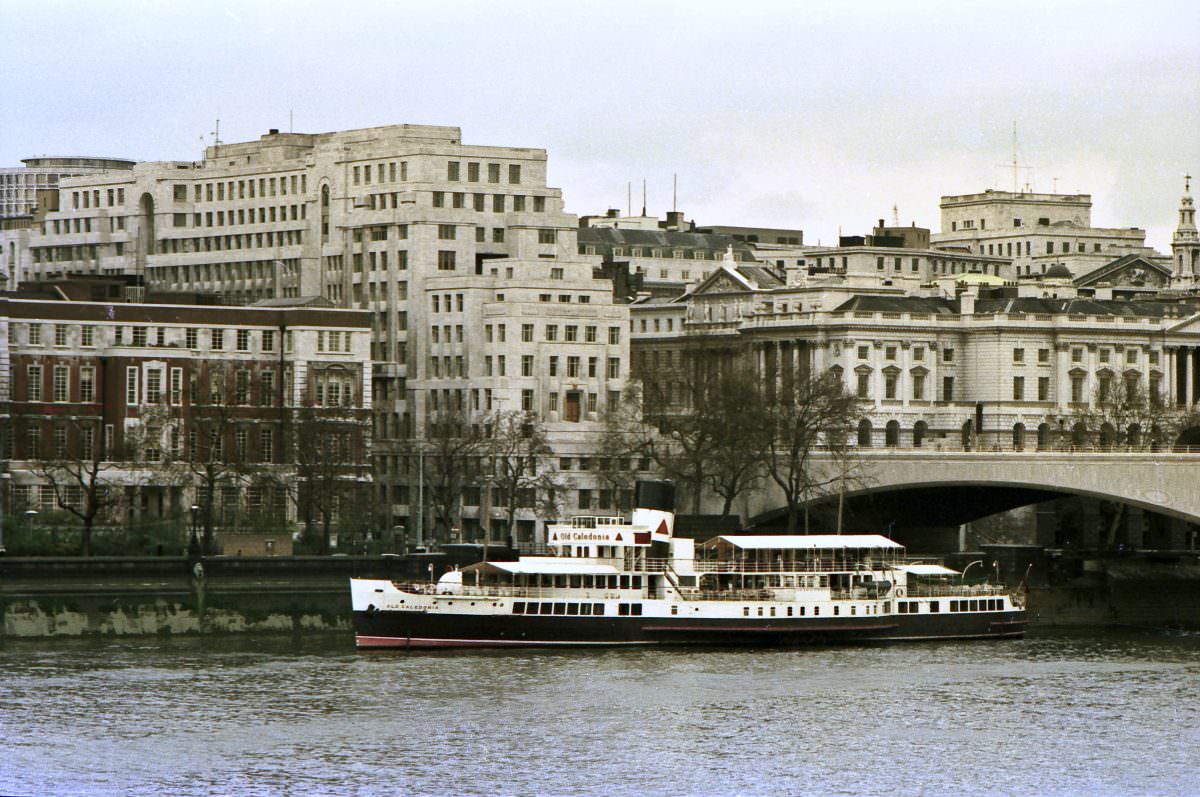 #13 Paddle steamer, ‘Old Caledonia’ moored by the Thames Embankment adjacent to Waterloo bridge. 19th April 1975