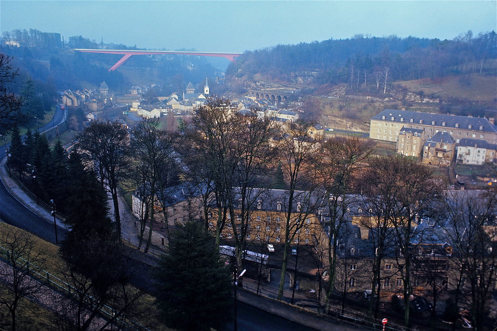 #37 A global view of the lower district of Luxembourg-Pfaffenthal featuring the GD Charlotte Bridge, The Vauban Towers, The Vauban barracks and the Civil Hospita. Luxembourg City, Jan 1972
